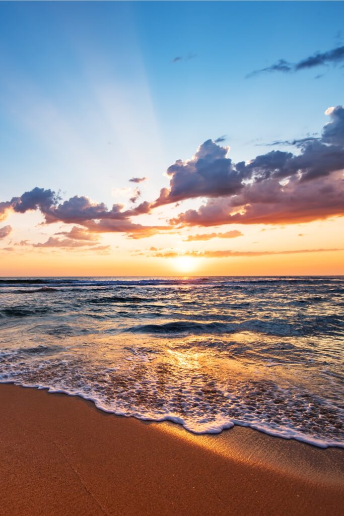 Colorful ocean beach sunrise.