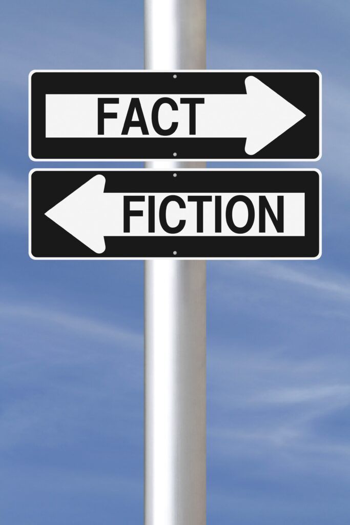 two signs pointing opposite directions that say "fact" and "fiction"