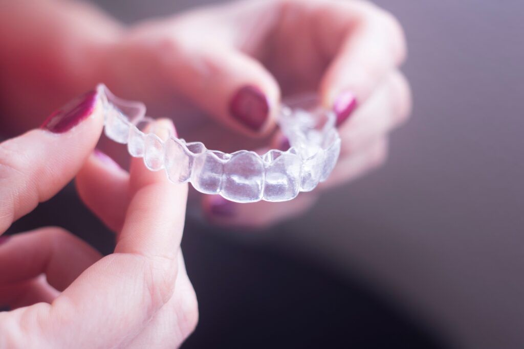 Clear dental teeth retainer brackets to straighten and align each tooth in modern dentistry technology.