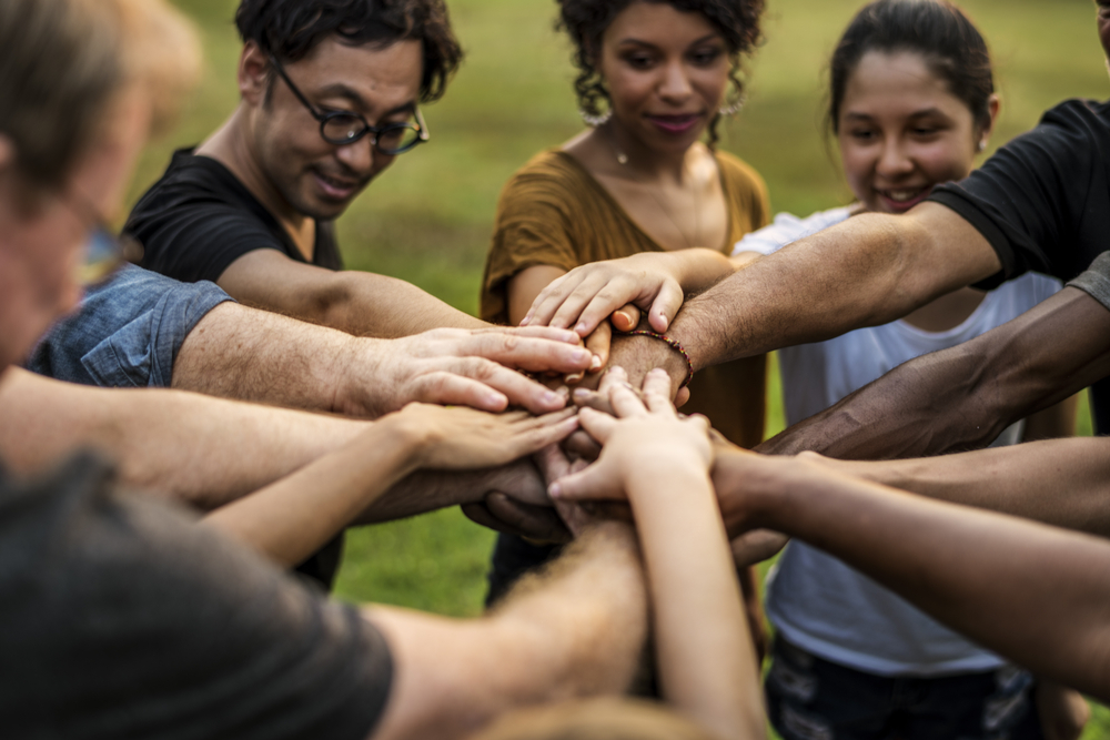 Group of people holding hand assemble togetherness