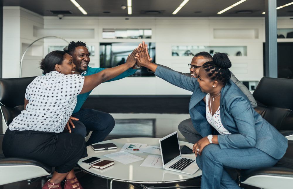 Friendly Successful All African Business Team Give High Five Together