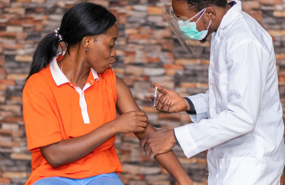 Young African Woman Getting Vaccinated