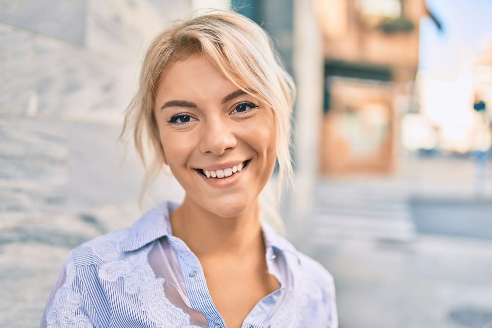 Young blonde woman smilin