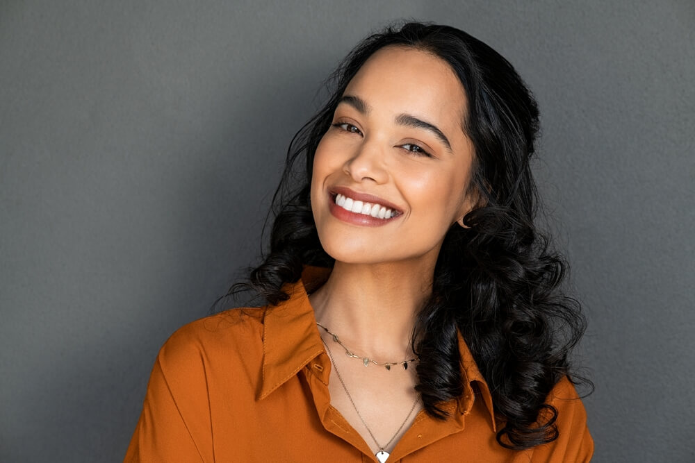 Close up face of young woman with beautiful smile