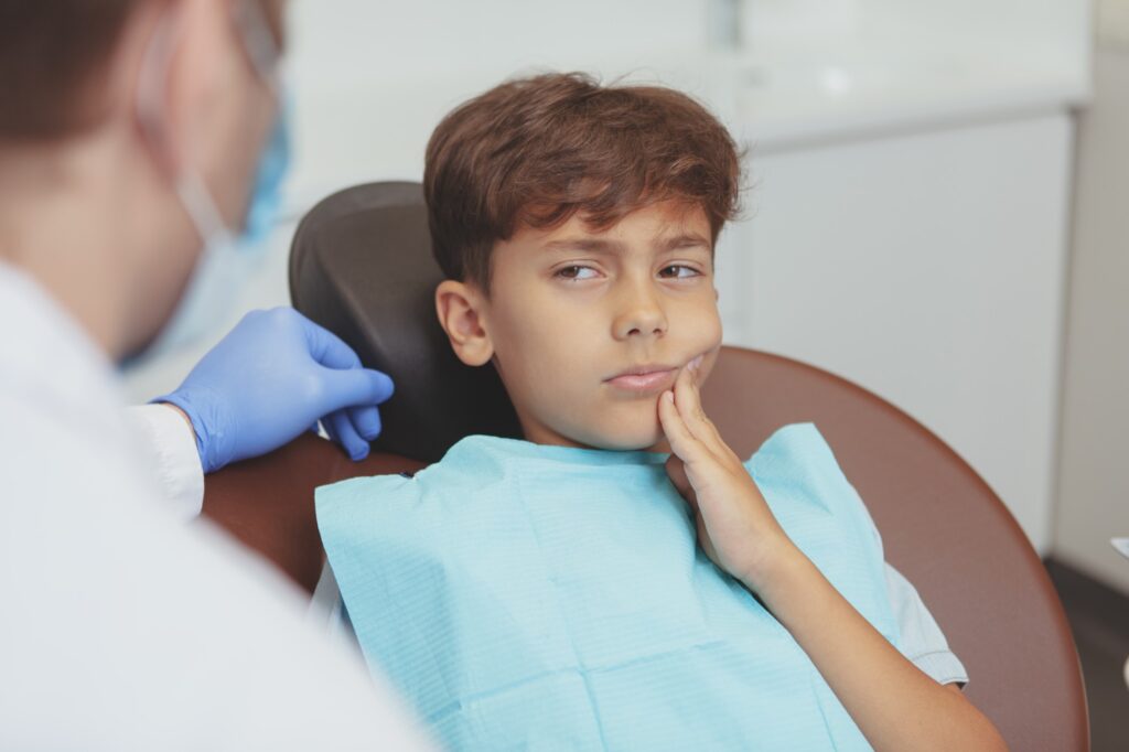 Young boy having toothache