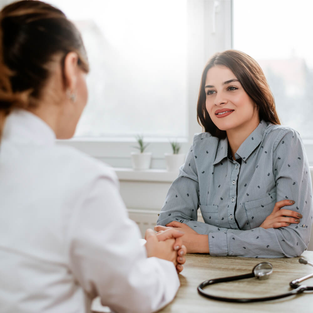 Beautiful young brunette woman at doctor's office.