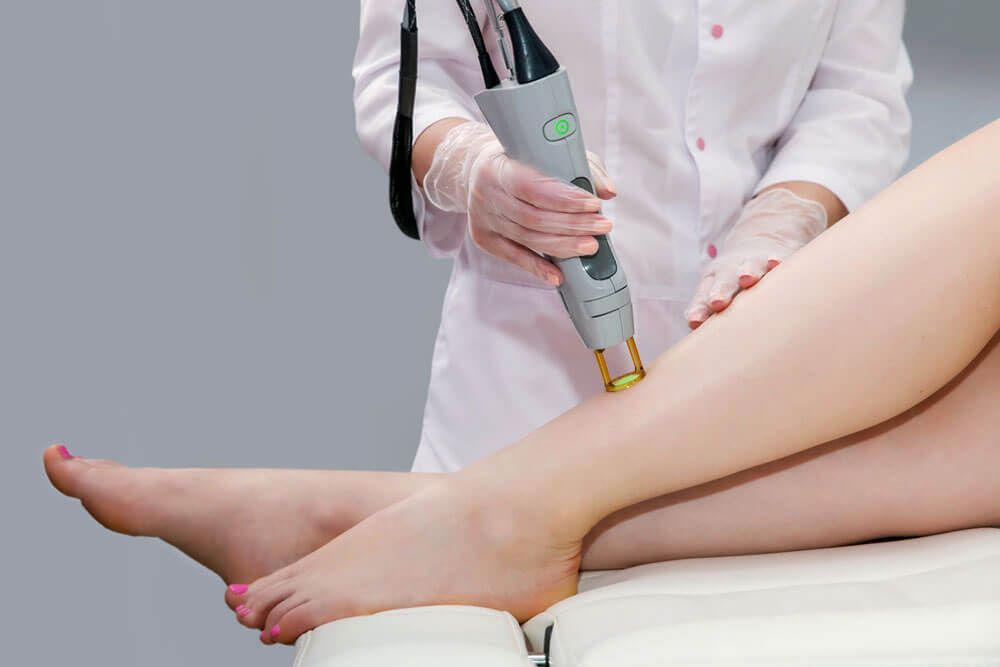 Hair removal cosmetology procedure from a therapist at cosmetic beauty spa clinic