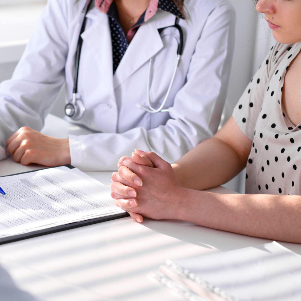 Doctor and patient are discussing something, just hands at the table