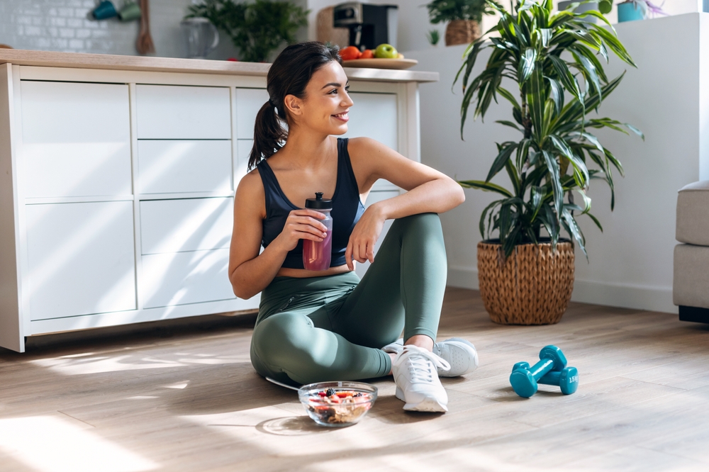 Shot of athletic woman drinking healthy protein shake
