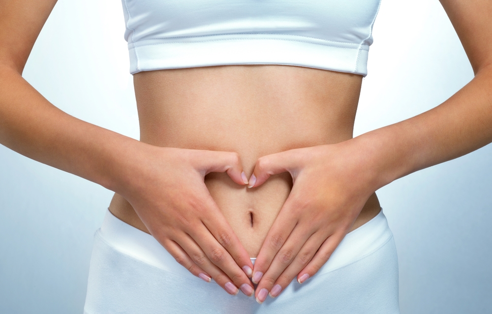 Person, symbol for love and girl in underwear, fibre and diet with nutrition, abdomen and tummy tuck