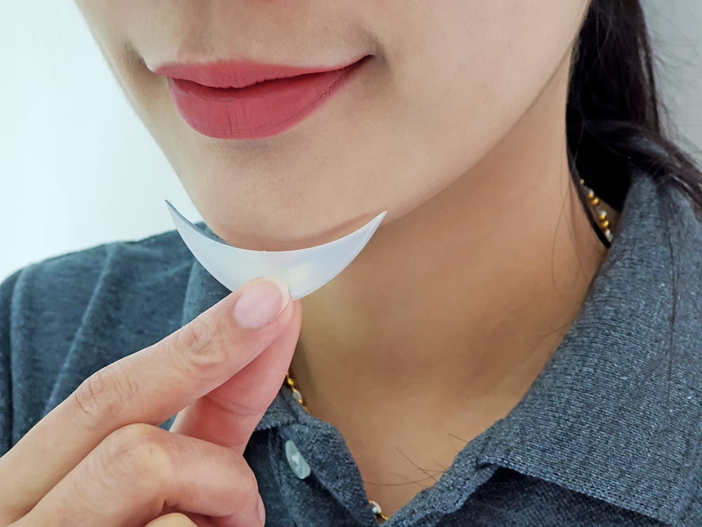 Silicone chin implant, Women tested before chin augmentation surgery, Facial Implants by doctors at the clinic or hospital.