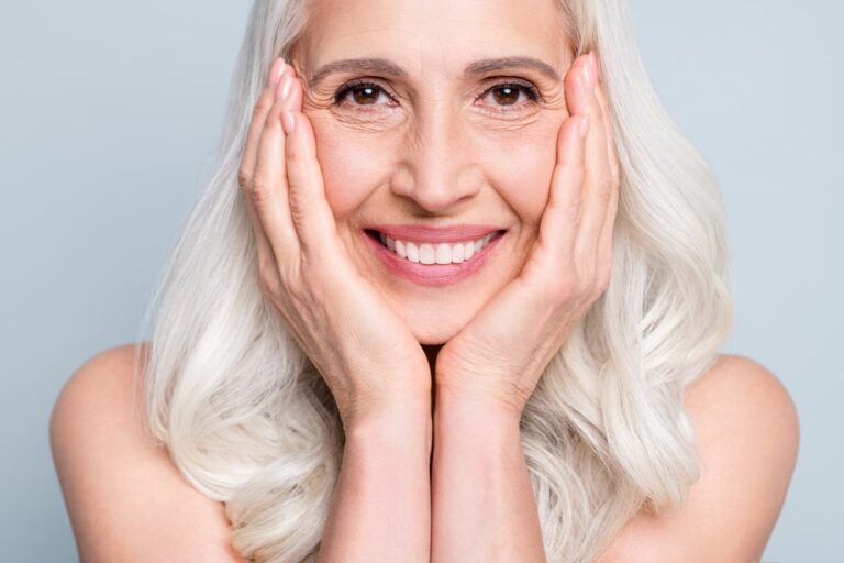 attractive cheery grey-haired elderly lady beaming smile