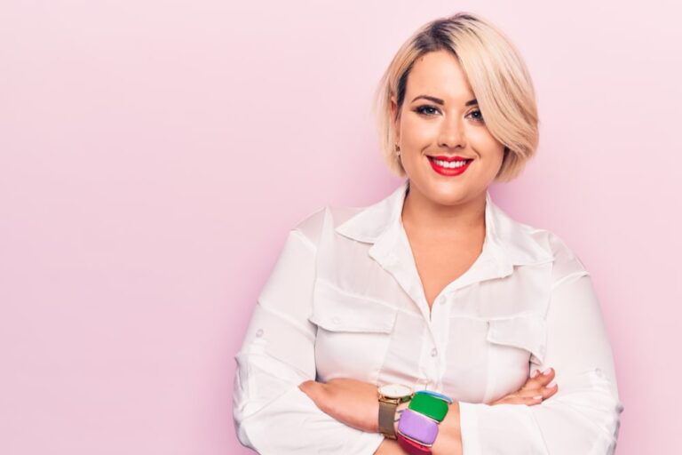 Young beautiful blonde plus size woman wearing elegant shirt