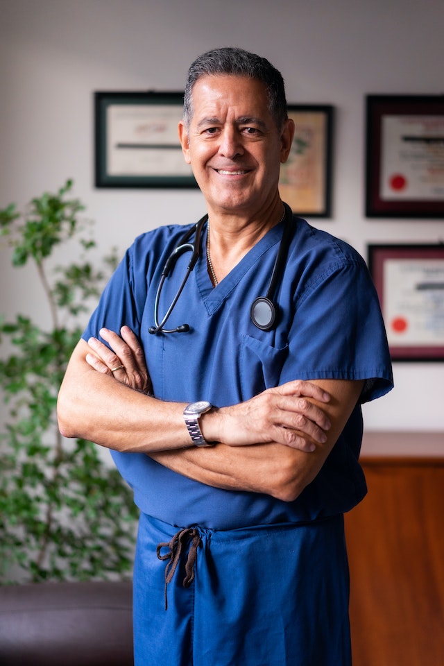 Aged doctor smiling