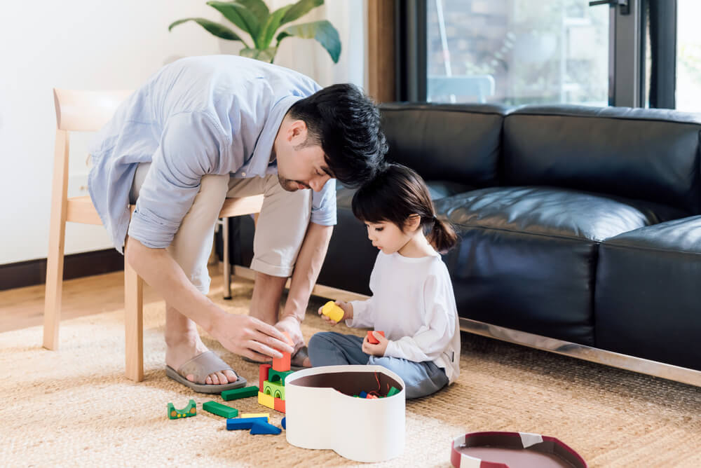 Father and daughter playing together