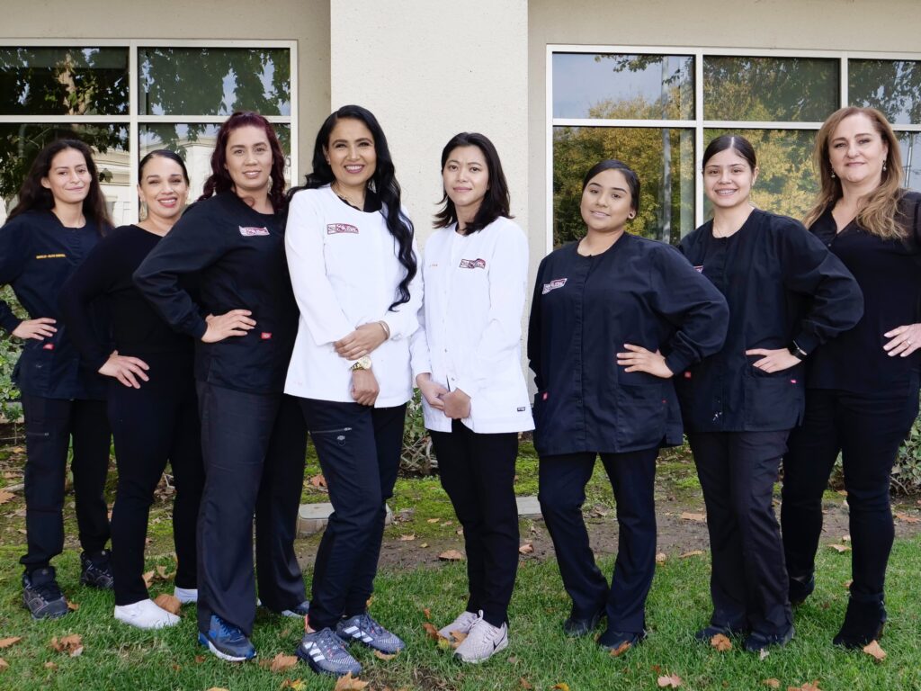 Harmeet Mann, DDS with staff