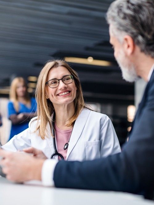 Doctor talking to a pharmaceutical sales representative.