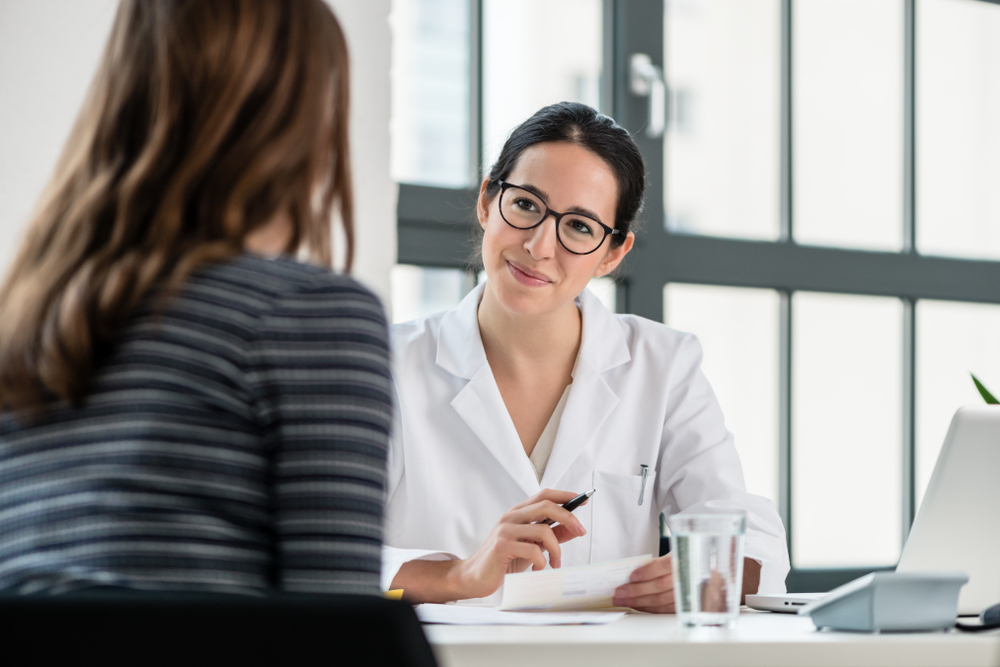 Female,Physician,Listening,To,Her,Patient,During,Consultation,While,Sitting