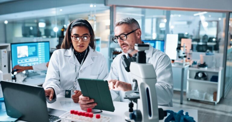 Collaboration, tablet or science with people in lab together for research or development