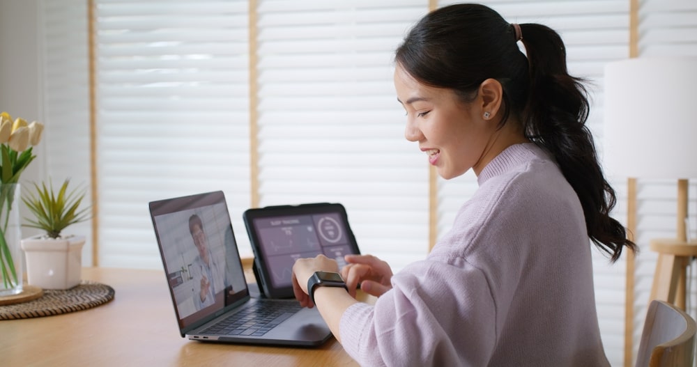 Asia people young woman video call talk chat help guide online at home by AI tele consult telehealth telemedicine app clinic in IoT device collect ECG data heart pulse sleep rate on cloud computing.