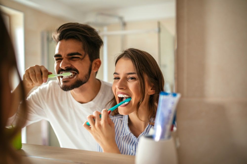 Couple doing a morning hygiene together