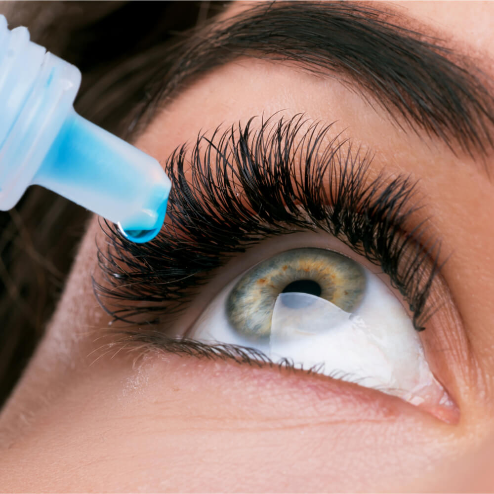 Close up of female face and eye drops