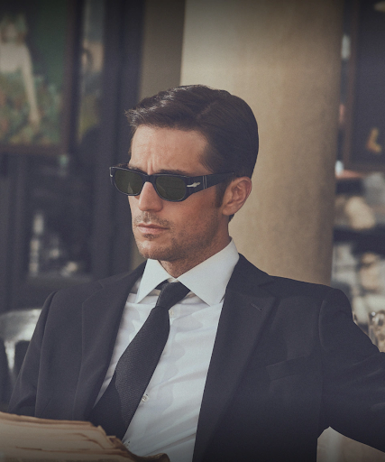Young handsome man in suite with stylish sunglasses