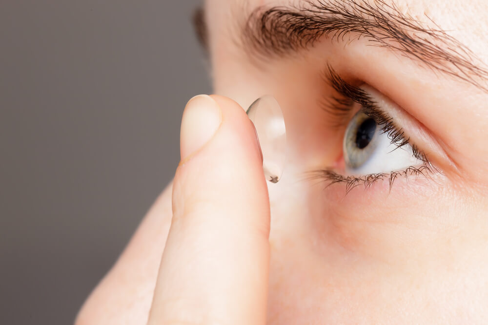 Girl changes the lenses to improve vision