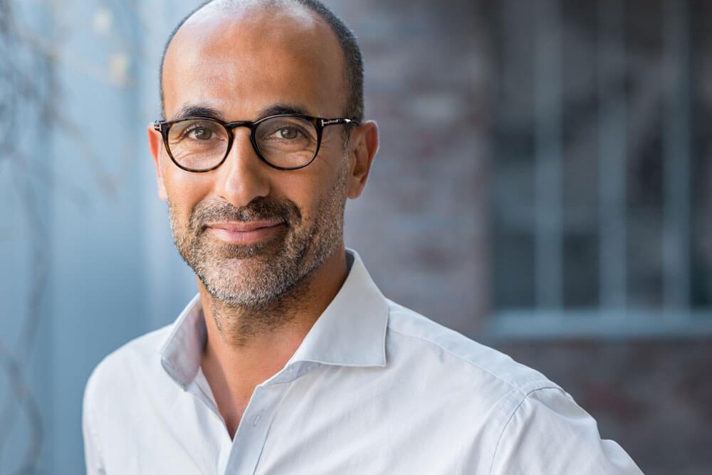 Happy mature man wearing spectacles