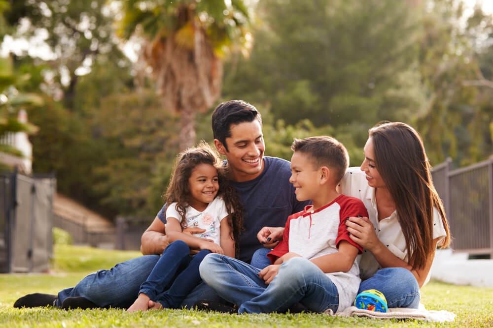 Happy young family sitting together