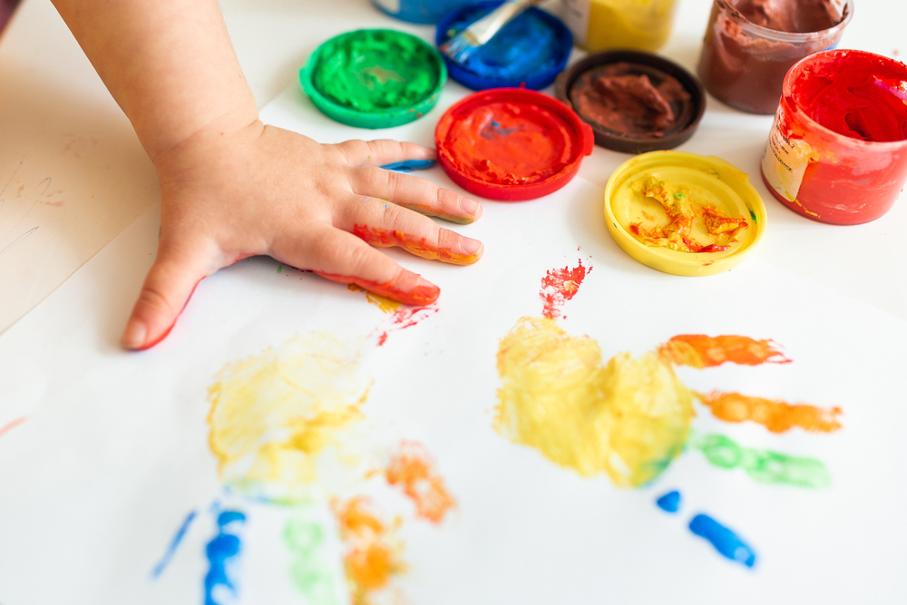 Close Up Of Colored Hand Print On White Background. Ideas