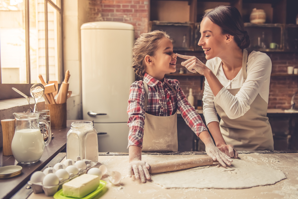 Beautiful Young Mom And Her Cute Little Daughter Are Playing