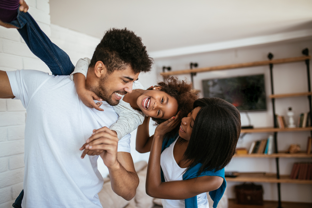 Shot Of A Happy Black Family Enjoying Spending Time Together