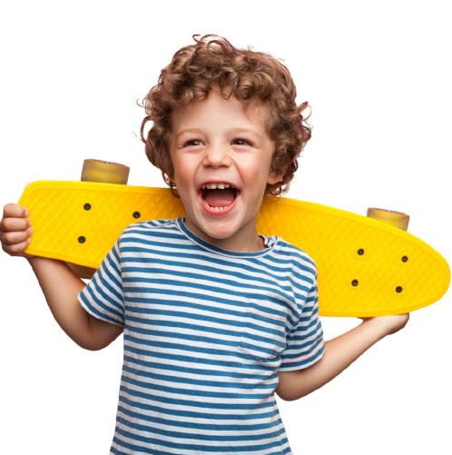 Happy curly boy laughing and holding bright colored skateboard