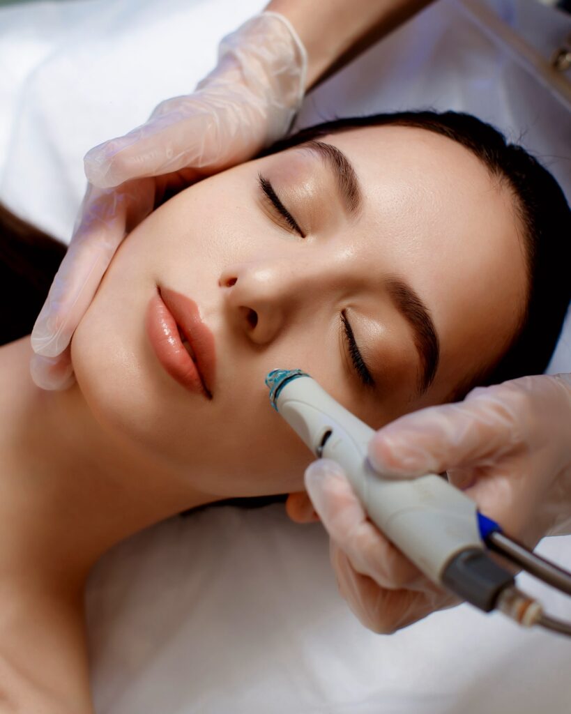 Female cosmetologist doing HydraFacial