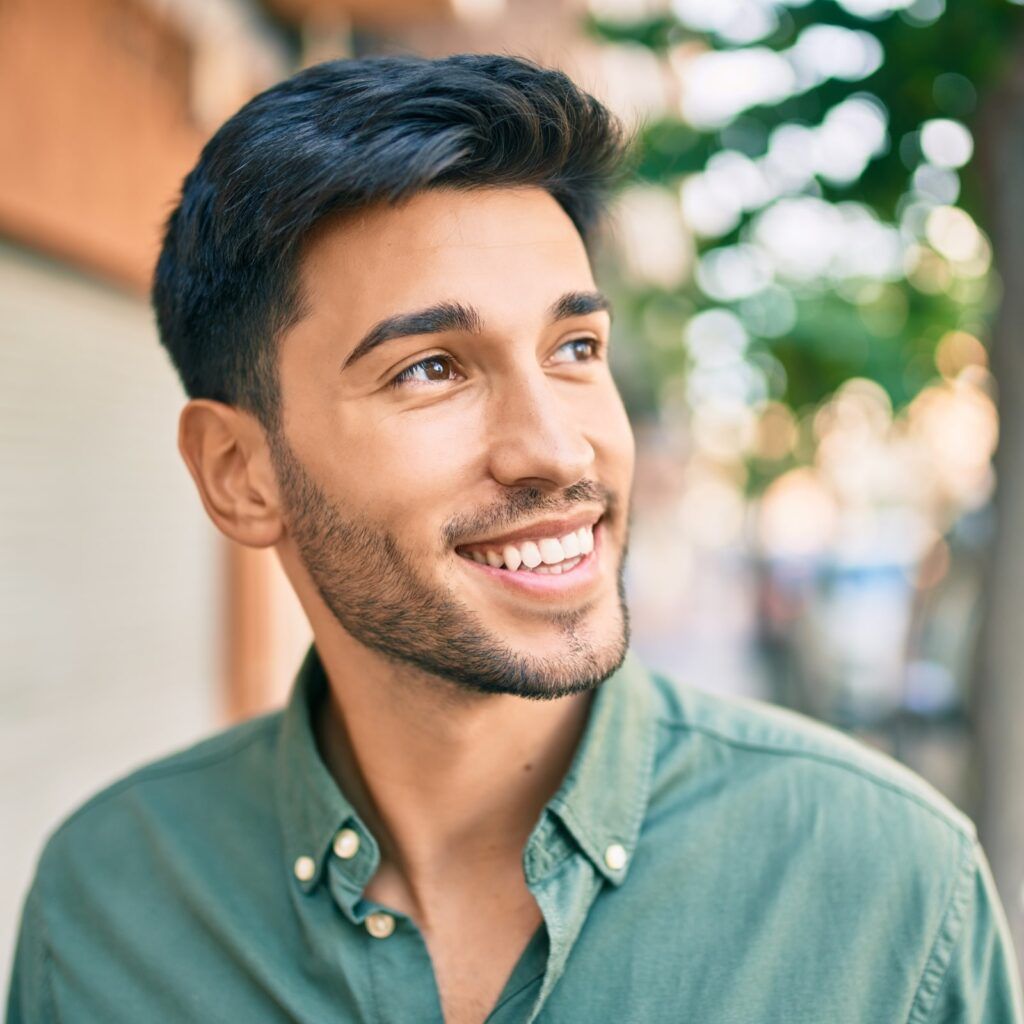 Young man smiling happy walking