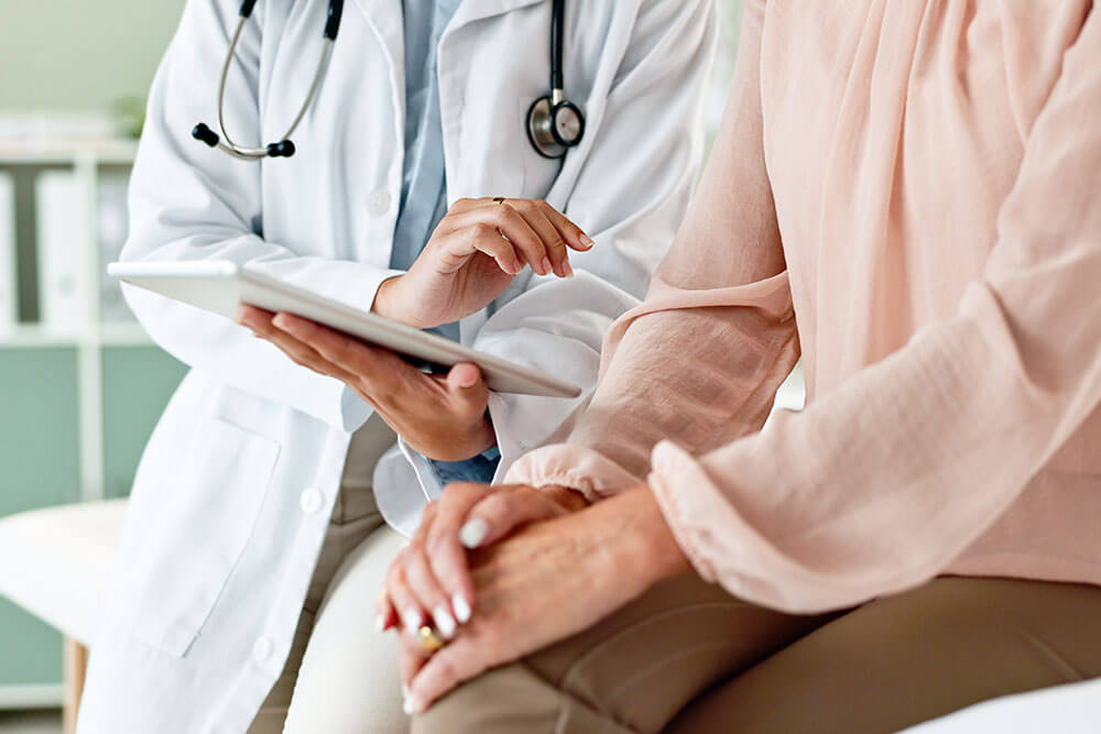 Hands of doctor with patient for consulting,