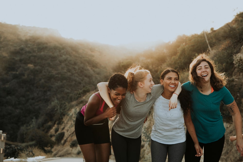 Friends hiking through the hills