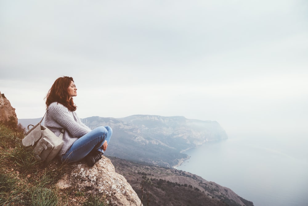 Girl travel in mountains alone