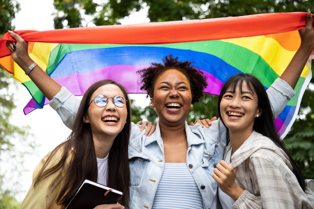 young women with rainbow flag