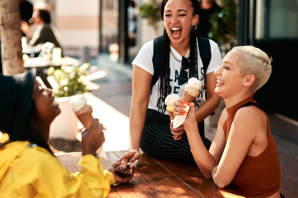 Friends, women and laughing in city