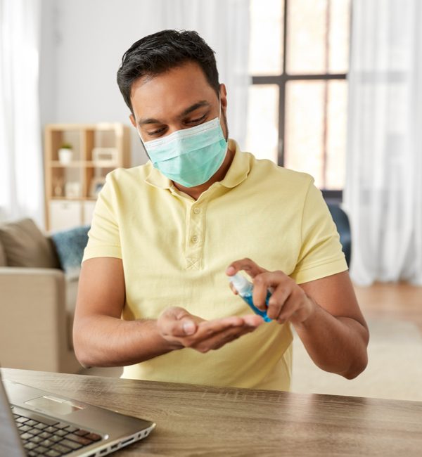 happy man wearing face protective medical mask for protection from virus disease