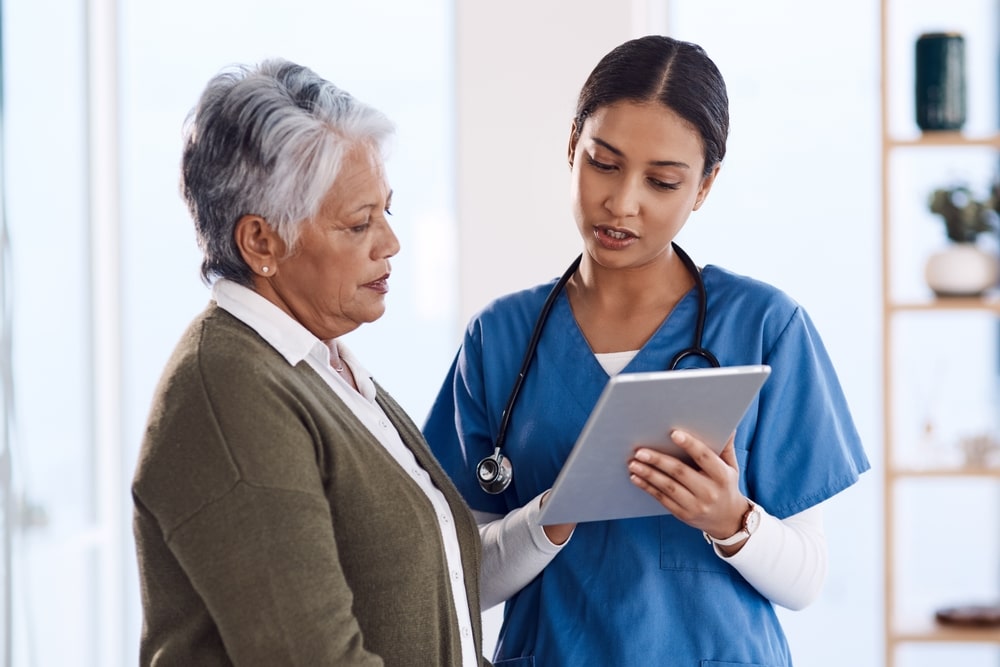 Young doctor using a digital tablet during a consultation