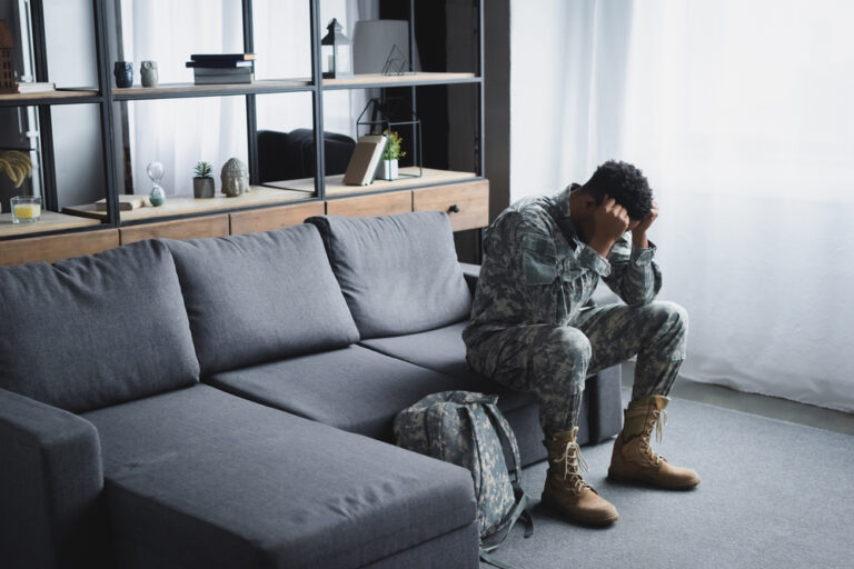 African American Soldier In Military Uniform Suffering From Ptsd At