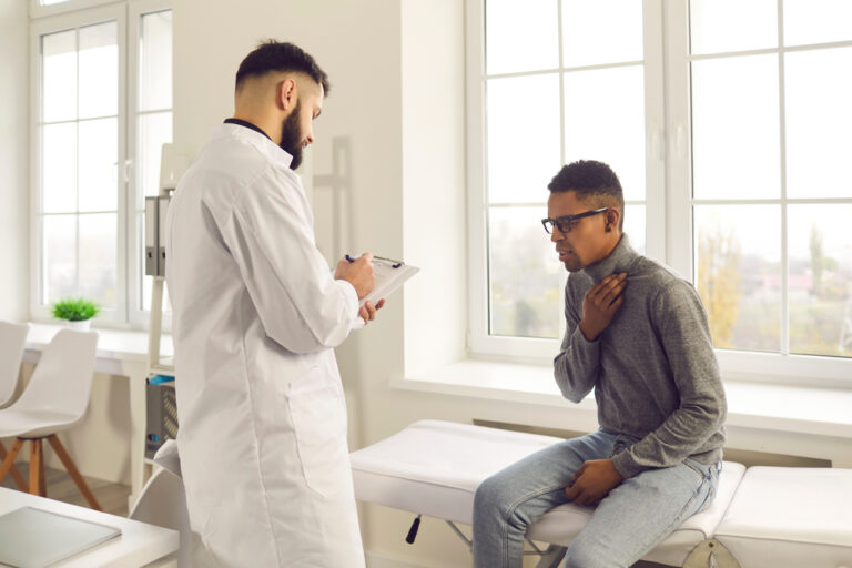 Patient Telling Doctor About Health Problems During Visit To Hospital.