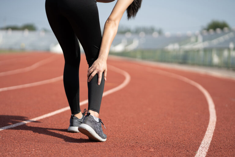 Asian Woman With Leg Pain After Morning Outdoor Exercise