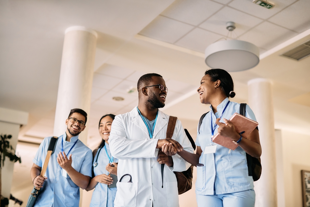 Low Angle View Of African American Medical Student Shaking Hands