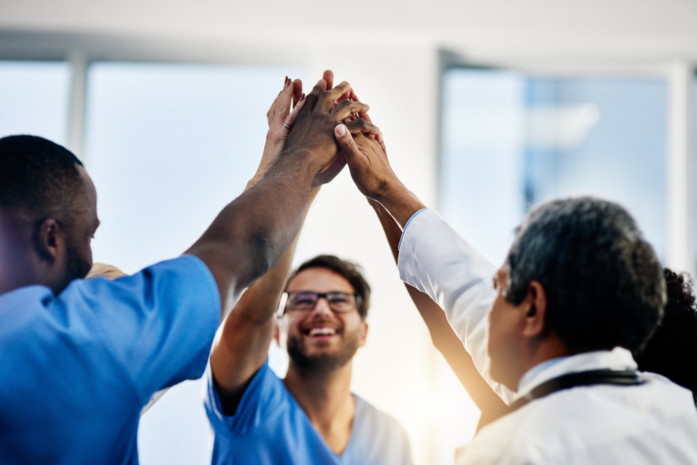 Doctors Celebrating Medical Success After Working Together As A Team