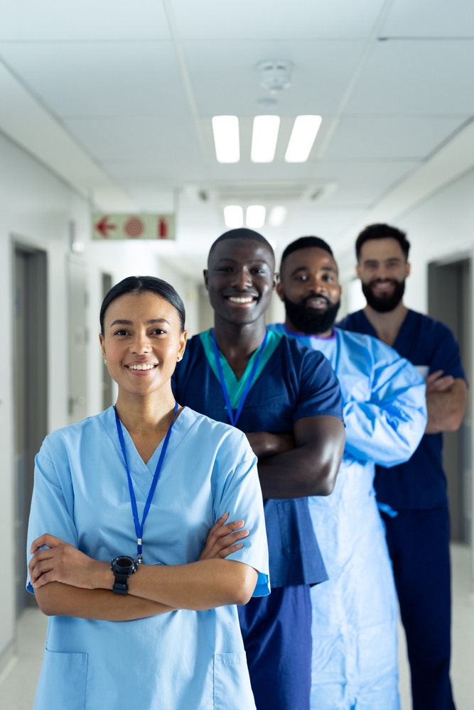 Vertical Portrait Of Diverse Group Of Smiling Healthcare Workers In