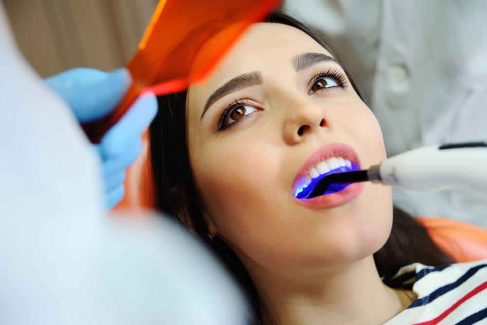 beautiful girl at the dentist. Dental fillings